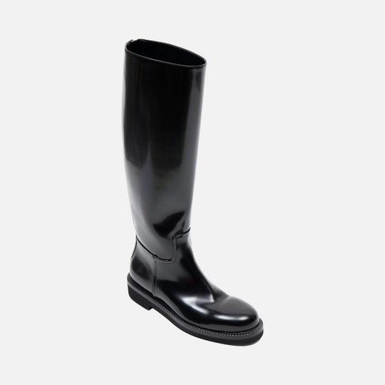 AERA ADA black brushed-effect knee-high boot, front three-quarter view of the tall shaft, rounded toe and low heel.