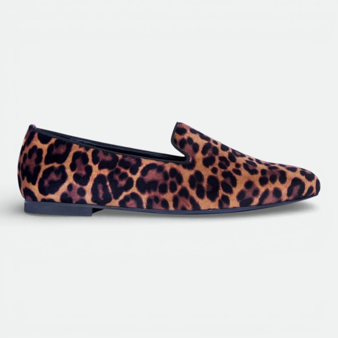 Leopard print velvet loafer with flat sole and almond toe on white background