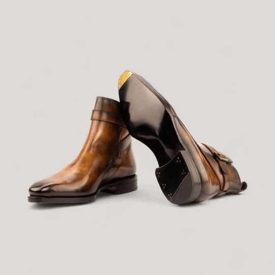 Tobacco patina Jodhpur boots showing the beveled sole and brass toe plate