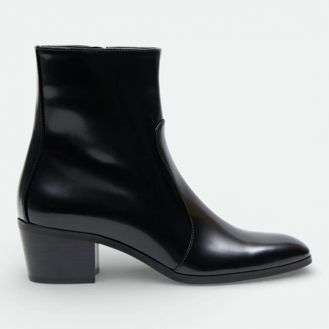 Black leather ankle boot with block heel and sleek minimalist design, side view