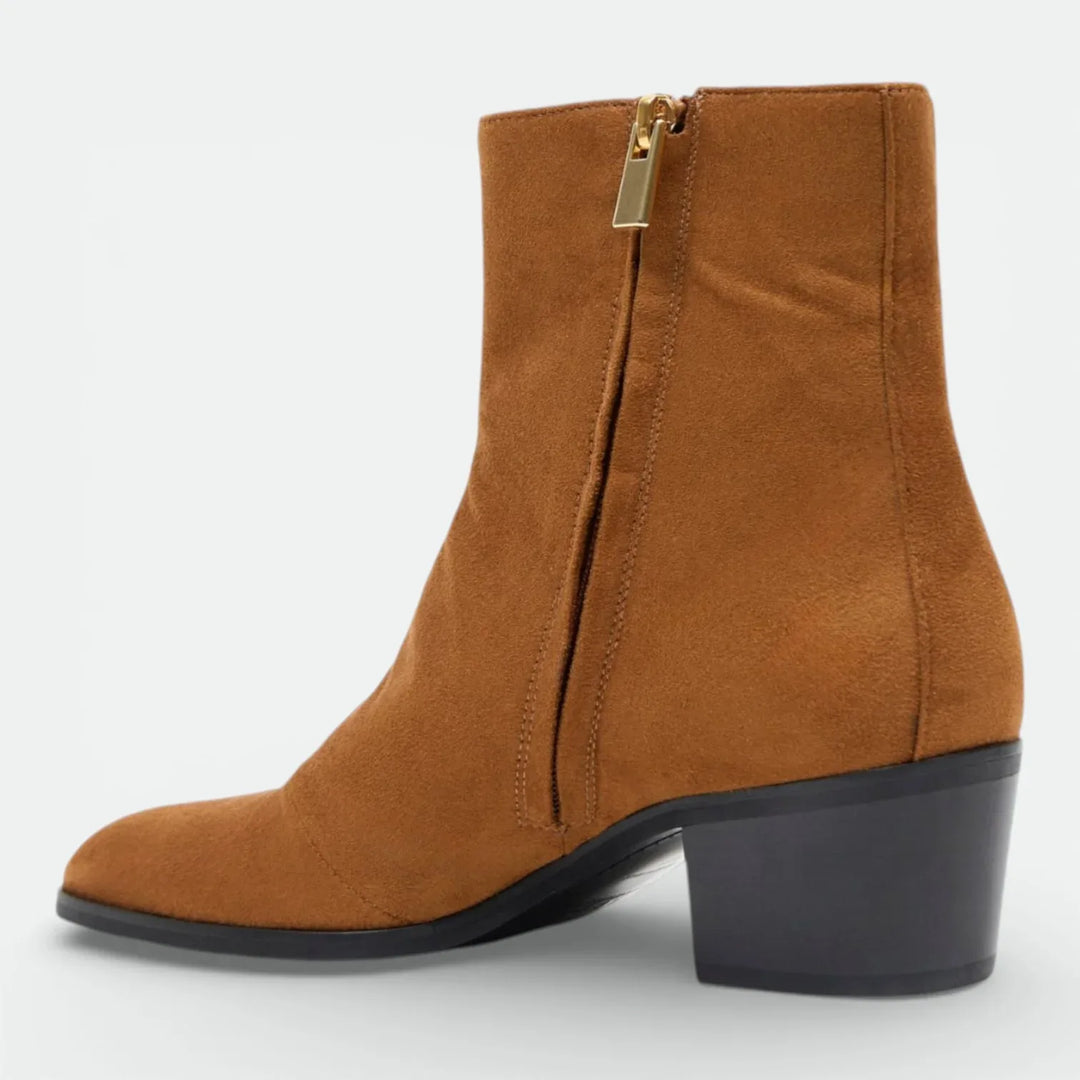 Brown suede ankle boot with side zipper and block heel on white background