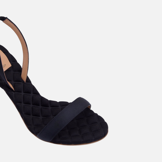AERA VIVIEN black satin slingback sandal, close-up of the front strap and quilted footbed.