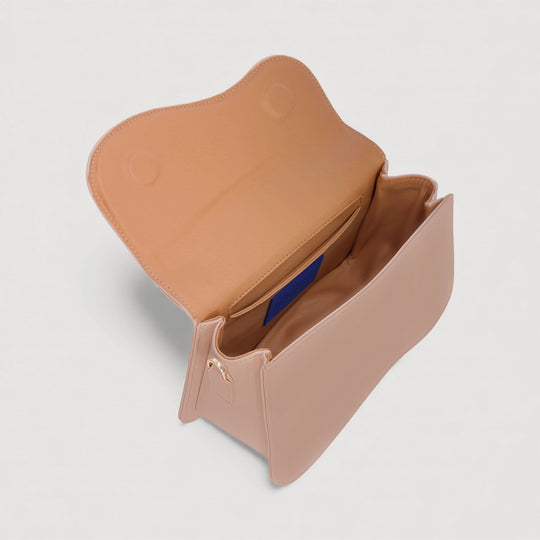 Inside view of Nami | Mini Crossbody Bag | Beige by ALEXANDRA K. VEGAN HANDBAGS at ALLTRUEIST, showcasing magnetic closure and compartments.