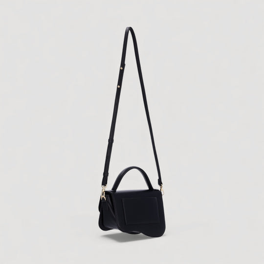 Nami | Mini Crossbody Bag | Black by ALEXANDRA K. VEGAN HANDBAGS at ALLTRUEIST, versatile and artful corn leather design with adjustable strap.